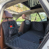 Frontal view of the PetSouks hard bottom seat cover installed in an SUV showing the pockets and the mesh window