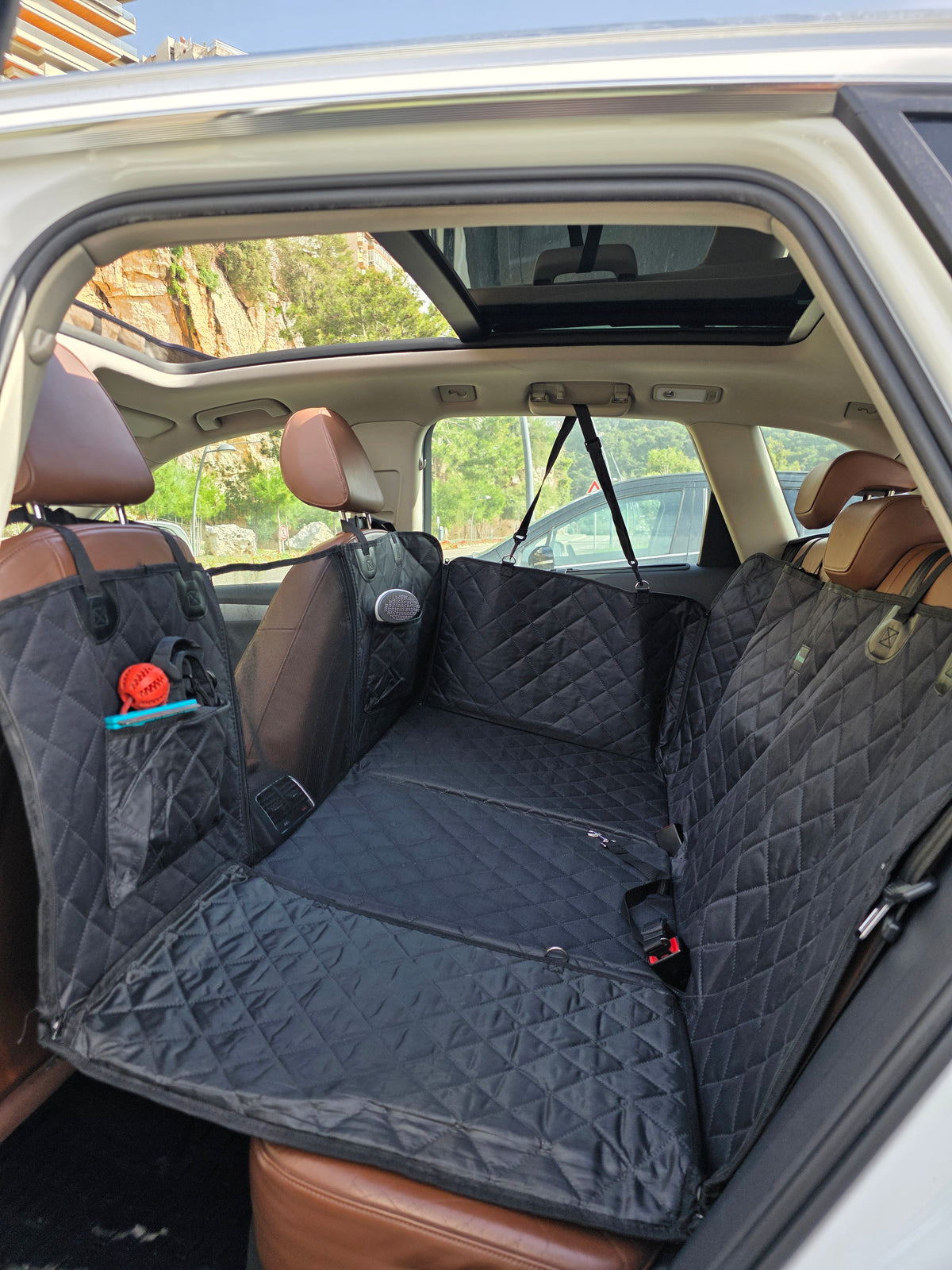 Frontal view of the PetSouks hard bottom seat cover installed in an SUV